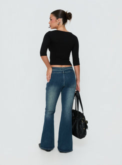 Presenting Runa Low Rise Tie Side Jeans Mid Blue Wash womens-jeans with flared wide-leg design back view of model wearing Princess Polly