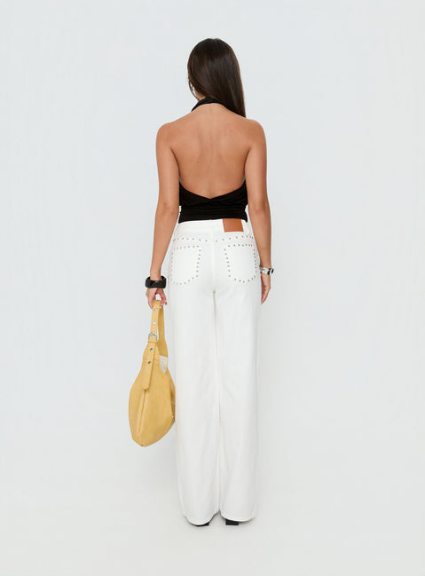 Displaying the Saving Up Mid Rise Straight Leg Studded Jeans White in womens-jeans with silver studded pockets and belt back view of model wearing Princess Polly