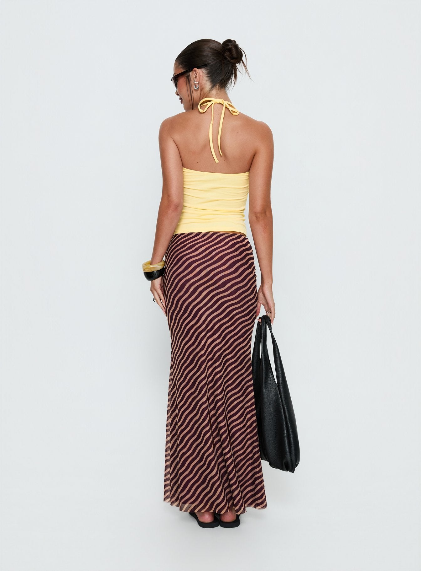back view of model wearing Princess Polly Caviar Tie Maxi Skirt Brown Stripe Maxi Skirts 