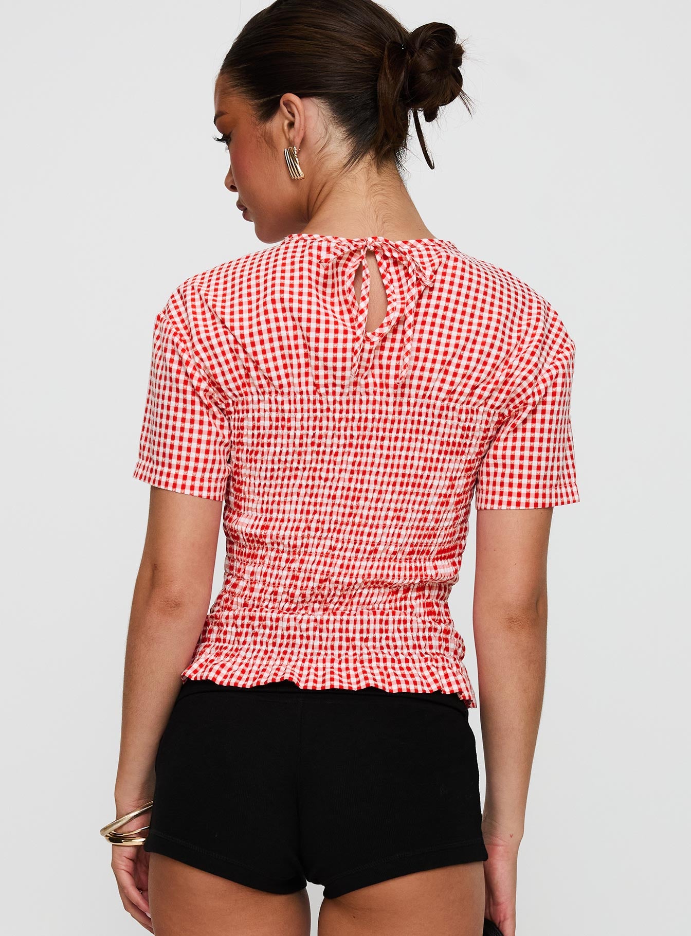 back view of model wearing Princess Polly Maybe Tomorrow Ruched Top Red Check Short Sleeves High Neck 