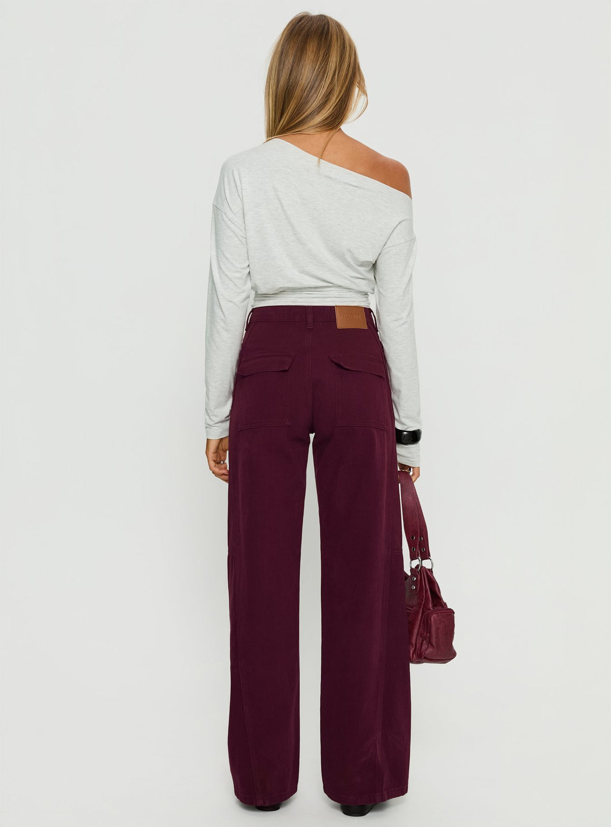 back view of model wearing Princess Polly Bruiser Tie Waist Mid Rise Wide Leg Jeans Currant High Rise Jeans 