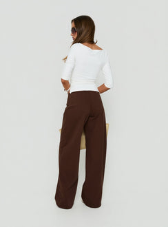 Displaying the Hereos Mid Rise Baggy Leg Jeans Washed Chocolate in womens-jeans back view of model wearing Princess Polly