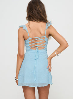 back view of model wearing Princess Polly Landon Mini Dress Blue Petite V-Neck 