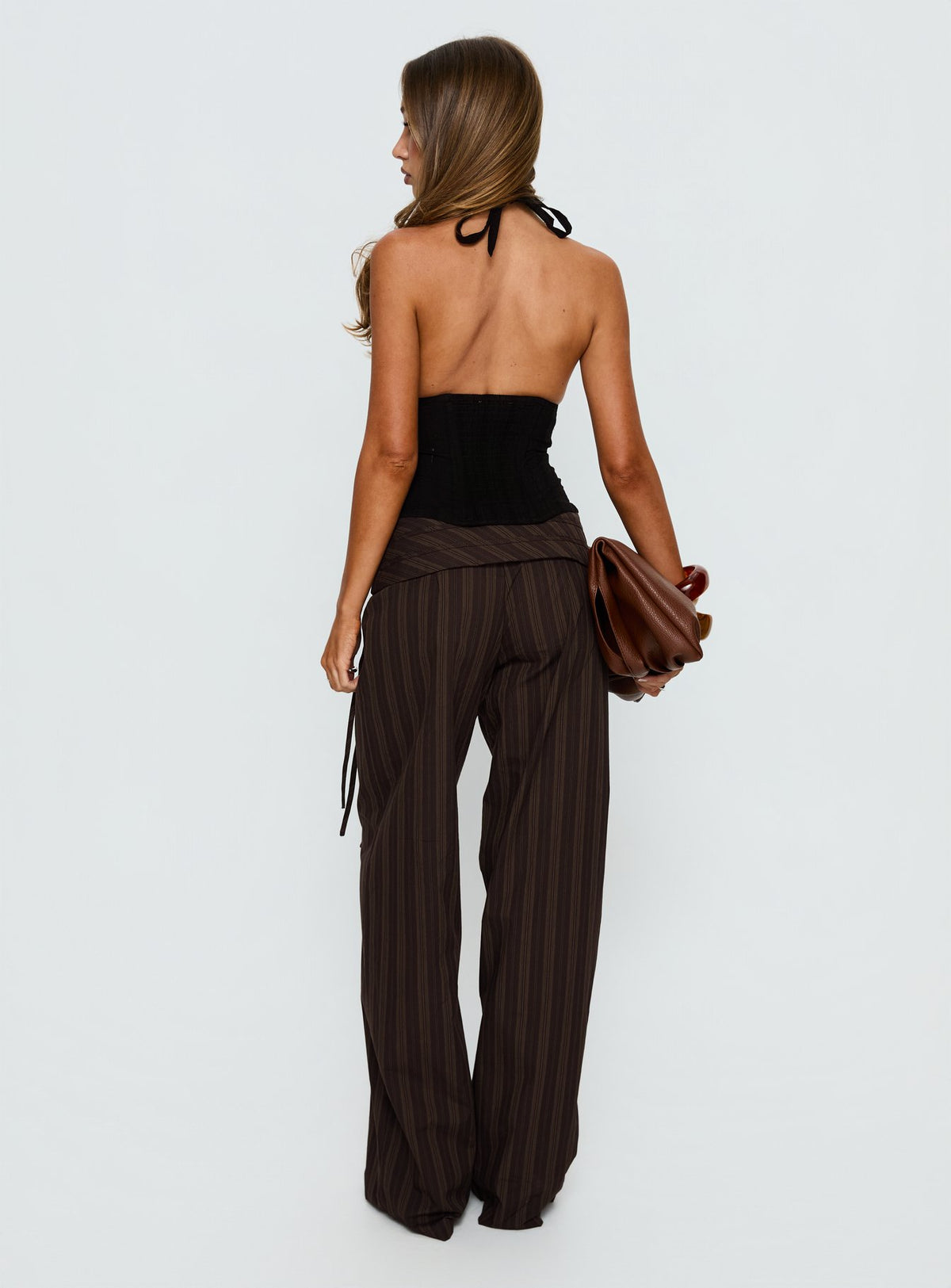 back view of model wearing Princess Polly Seneca Wrap Pant Brown Stripe Mid Rise Pants 