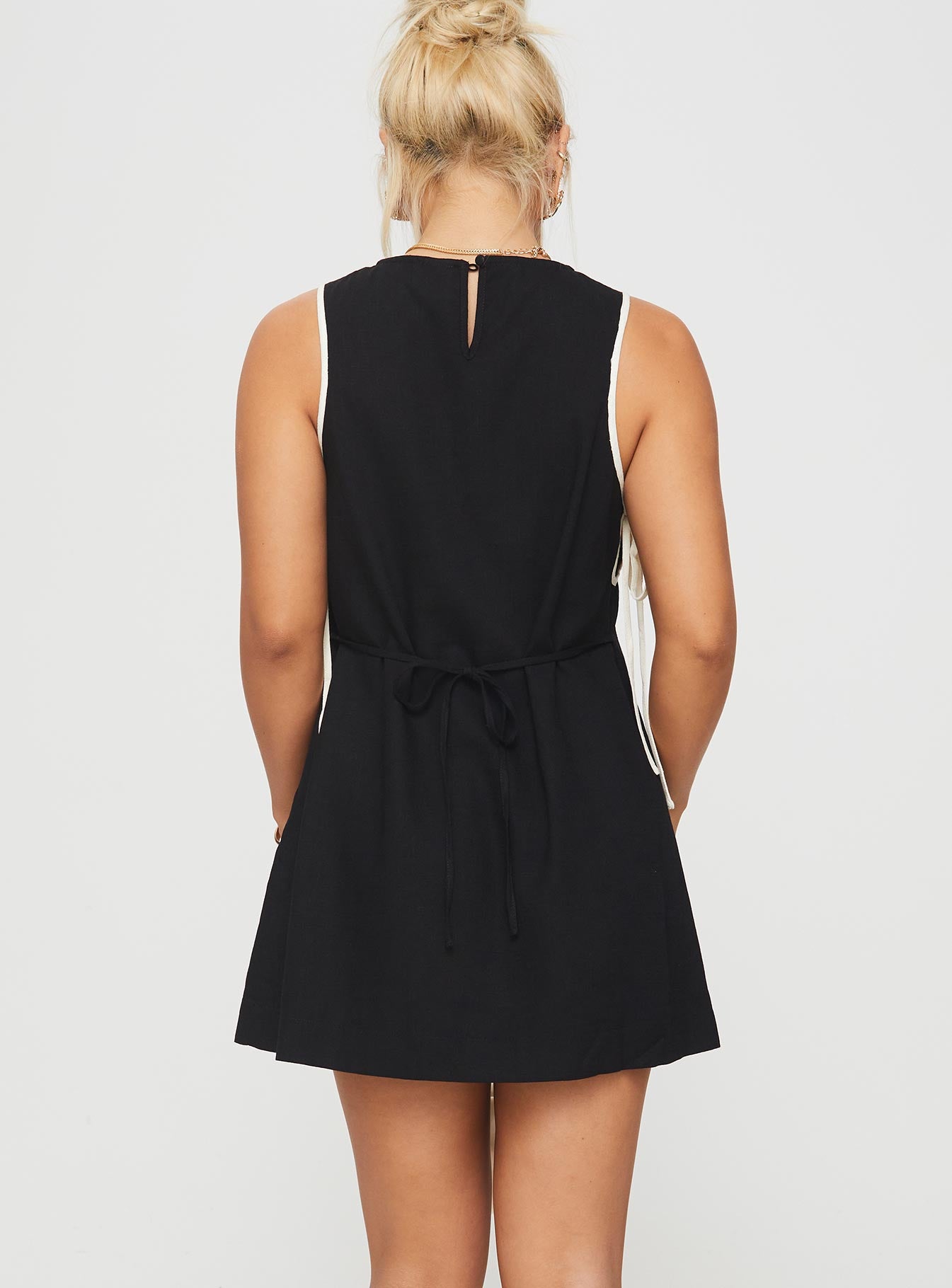 back view of model wearing Princess Polly Boxay Mini Dress Black Crew Neck 