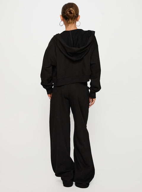 back view of model wearing Princess Polly Mindful Low Rise Pant Black Low Rise Pants 