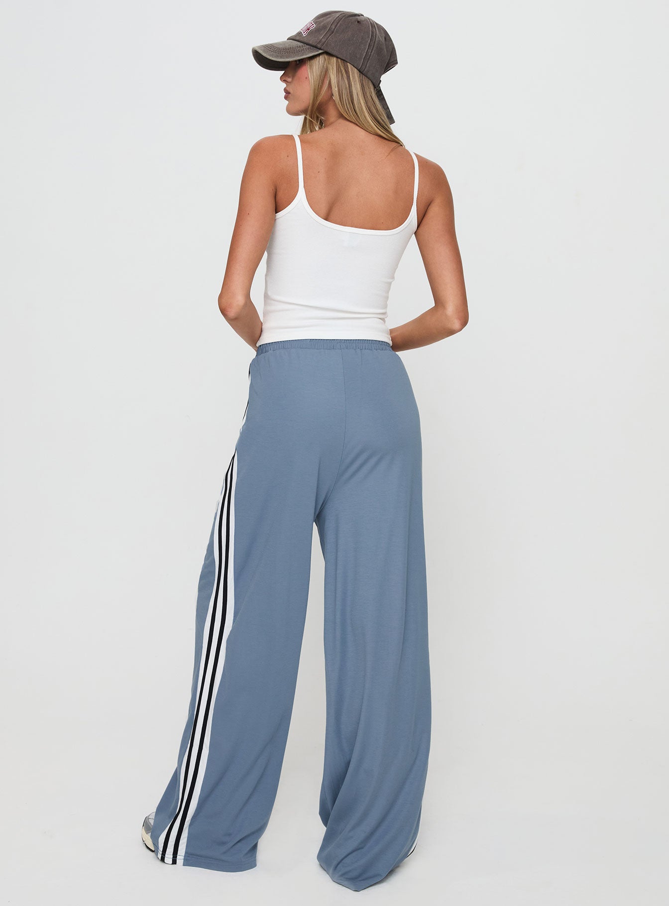 back view of model wearing Princess Polly Dime Track Pants Blue High Waisted Pants 
