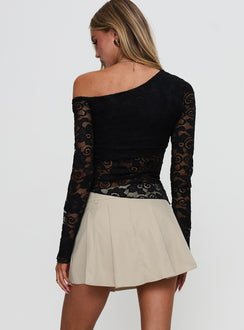 back view of model wearing Princess Polly Khaite Pleated Mini Skirt Beige Mini Skirts Skirts 