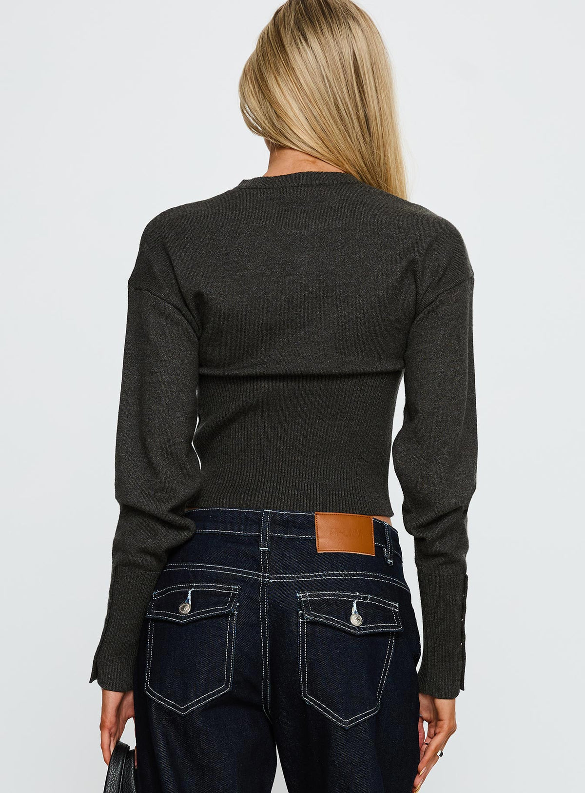 back view of model wearing Princess Polly Head In The Clouds Knit Cardigan Grey Argyle cropped 