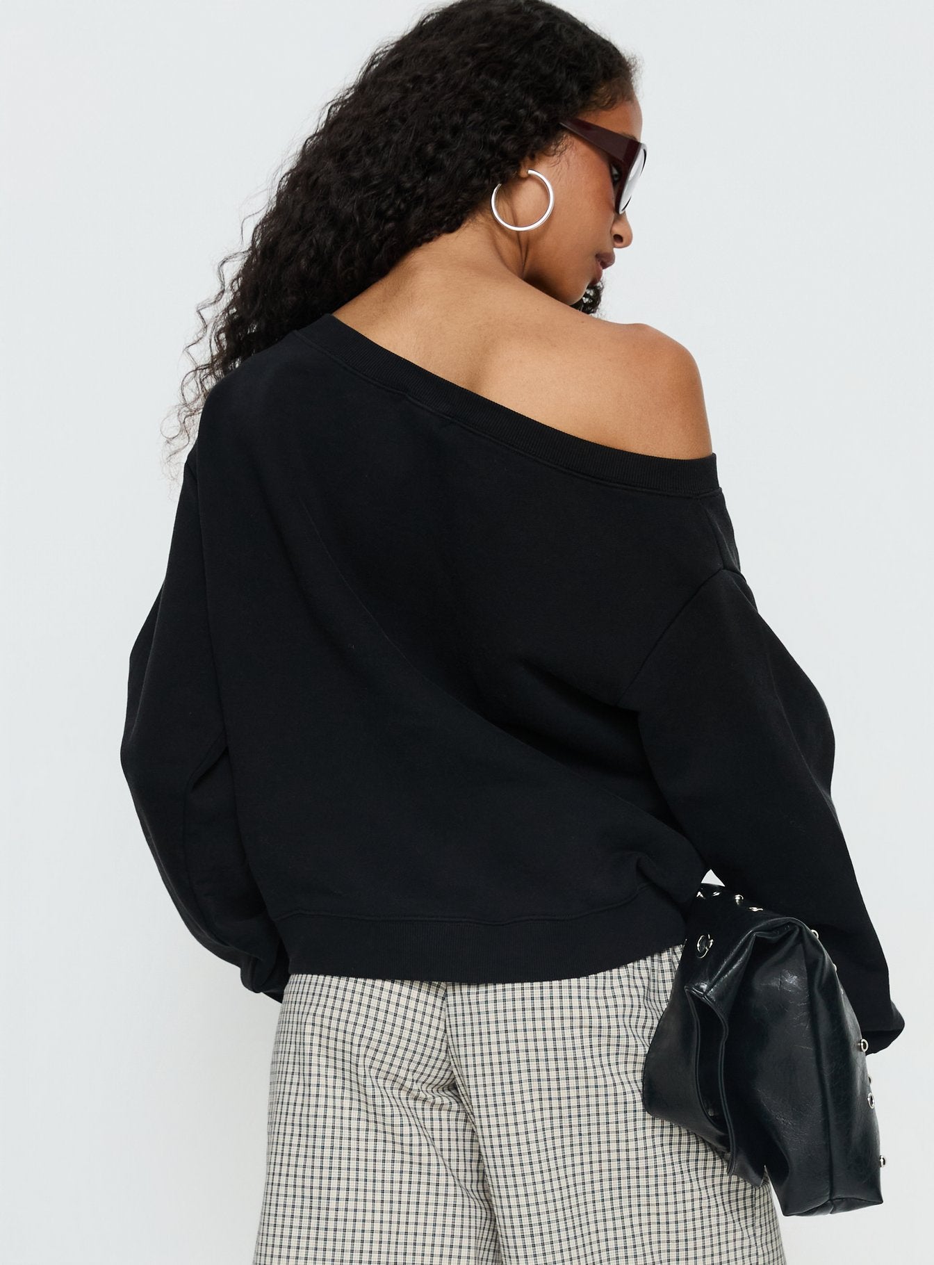 back view of model wearing Princess Polly Wellness Off the Shoulder Jumper Washed Black Longline Jumpers 