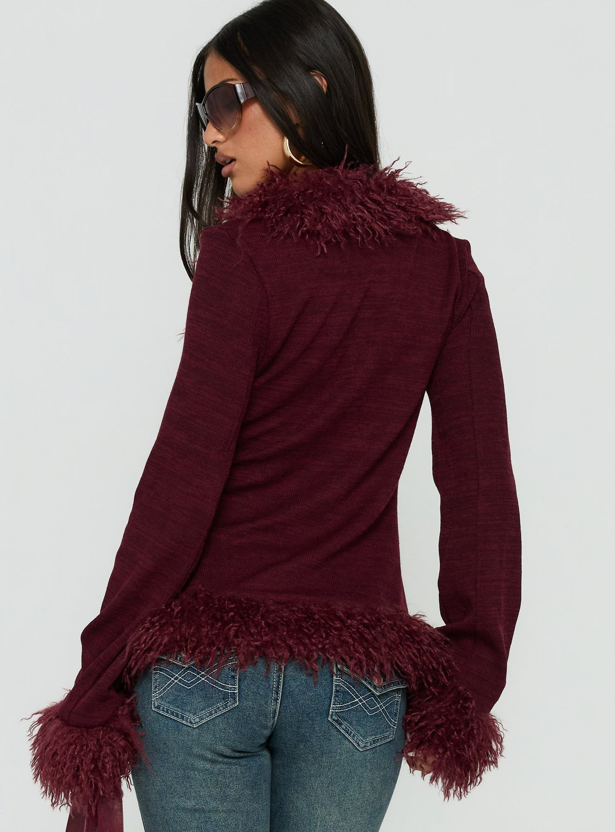 Crafted from the Brynlie Faux Fur Trim Boxy Cardigan Burgundy womens jumper in short length back view of model wearing Princess Polly