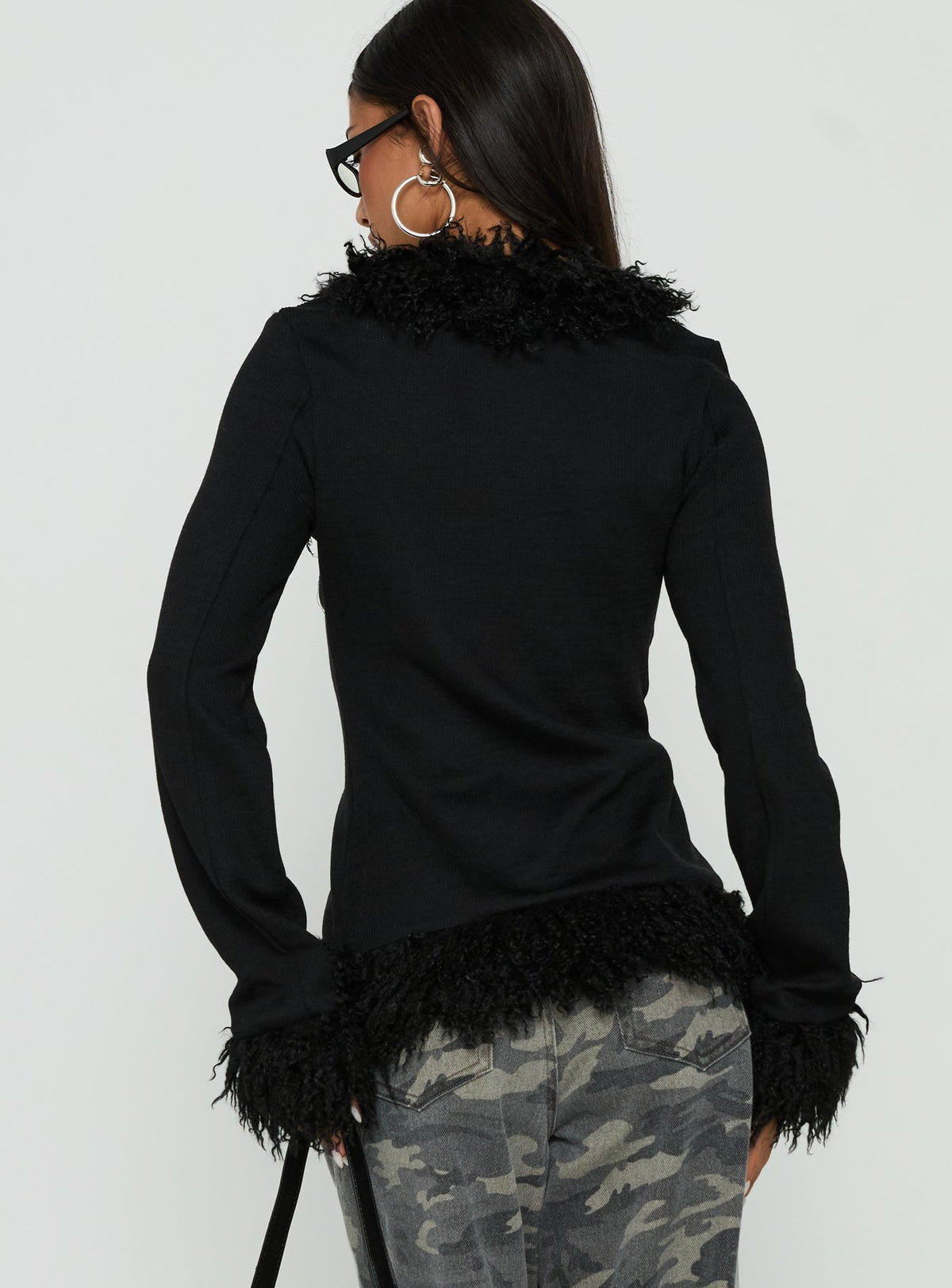 Designed with the Brynlie Faux Fur Trim Boxy Cardigan in Black womens-jumpers featuring short length back view of model wearing Princess Polly