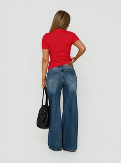 Presenting Celinia Mid Rise Asymmetrical Baggy Jeans Dark Indigo womens-jeans featuring mid-rise back view of model wearing Princess Polly