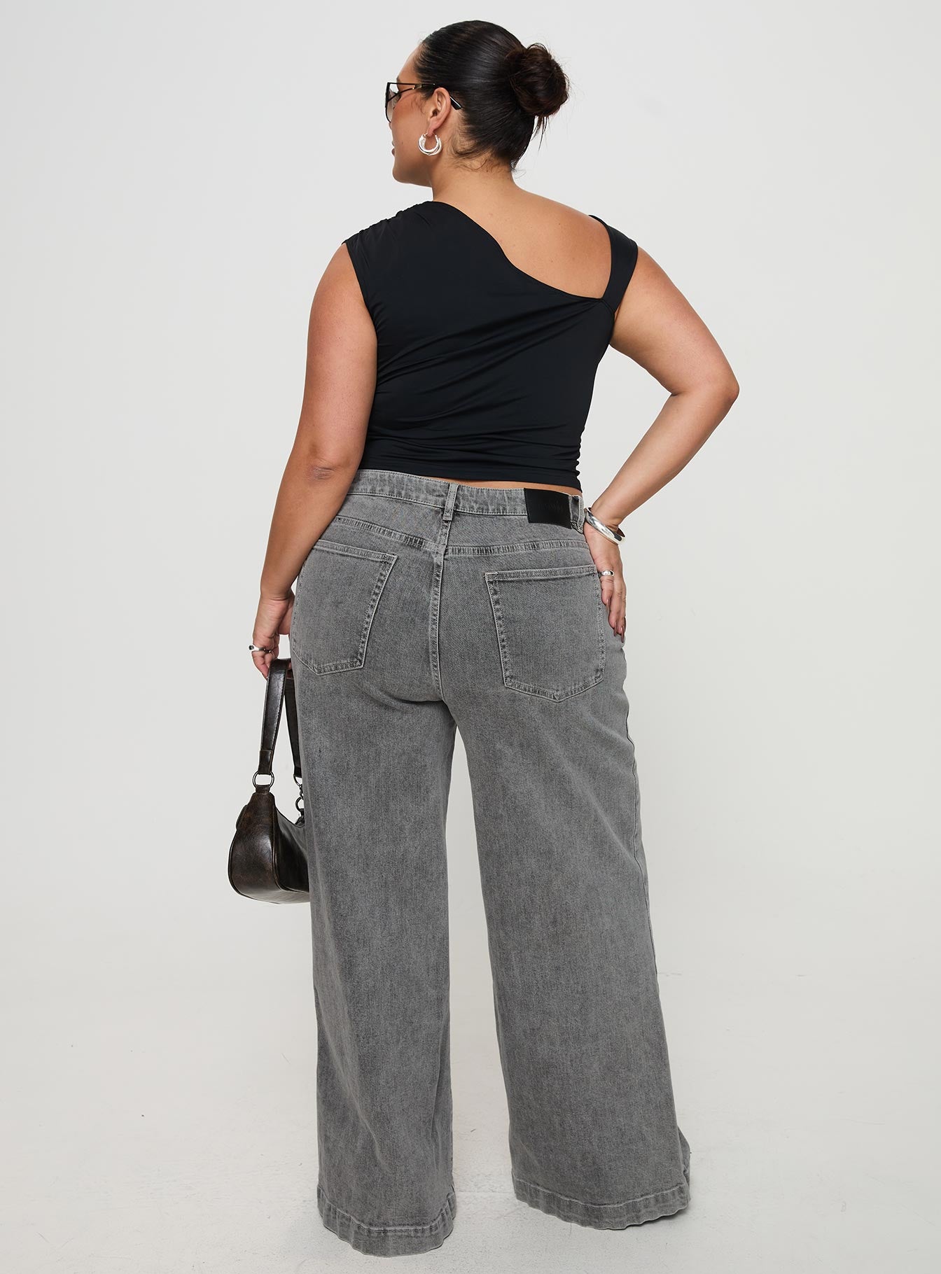 back view of model wearing Princess Polly Wolfie High Rise Wide Leg Slouchy Jeans Steel Curve High Rise Jeans Jeans 