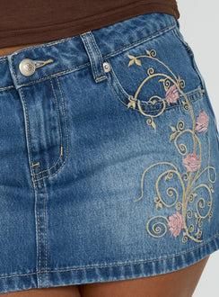 Highlighting the Flatline Embroidered Denim Mini Skirt Mid Wash in womens-skirts with mini length product