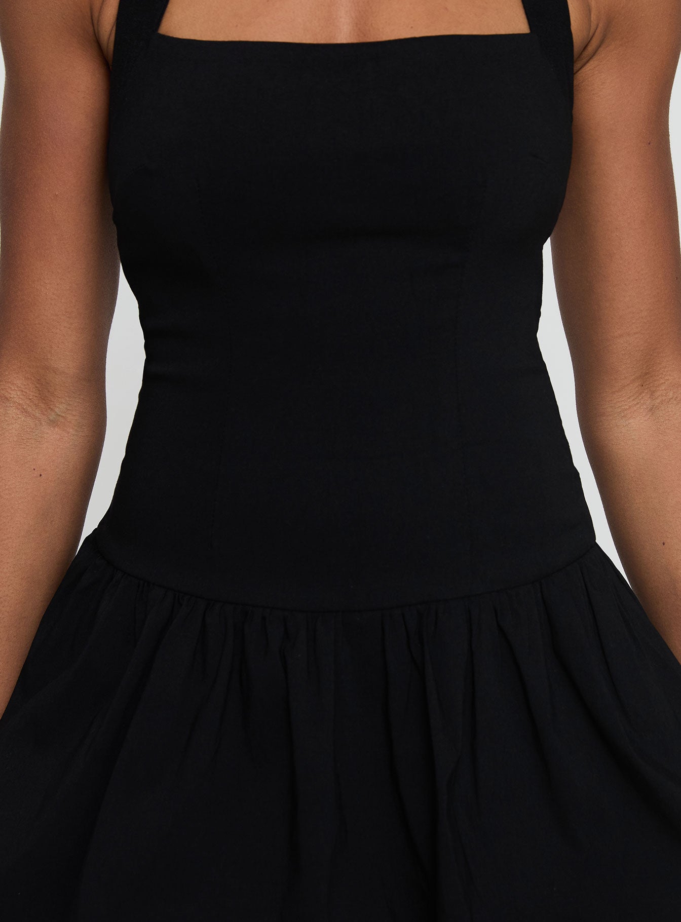 back view of model wearing Princess Polly Gigli Bubble Hem Mini Dress Black Petite Square Neck 