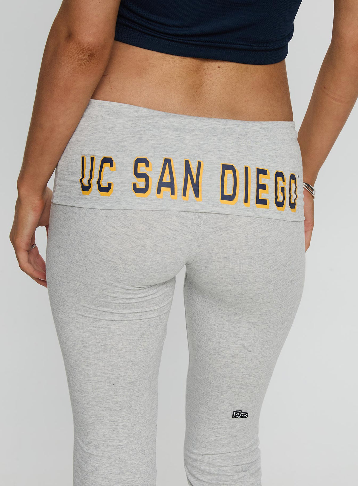 front view of model wearing Princess Polly UC San Diego Foldover Pant Heather Grey Mid Rise Pants 