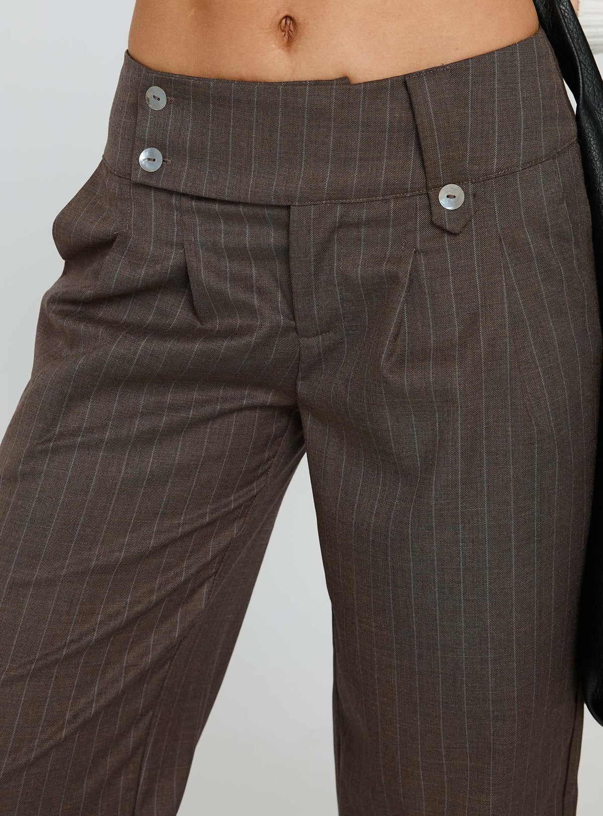 side view of model wearing Princess Polly Briellea Thick Waistband Pant Pinstripe Low Rise Pants 