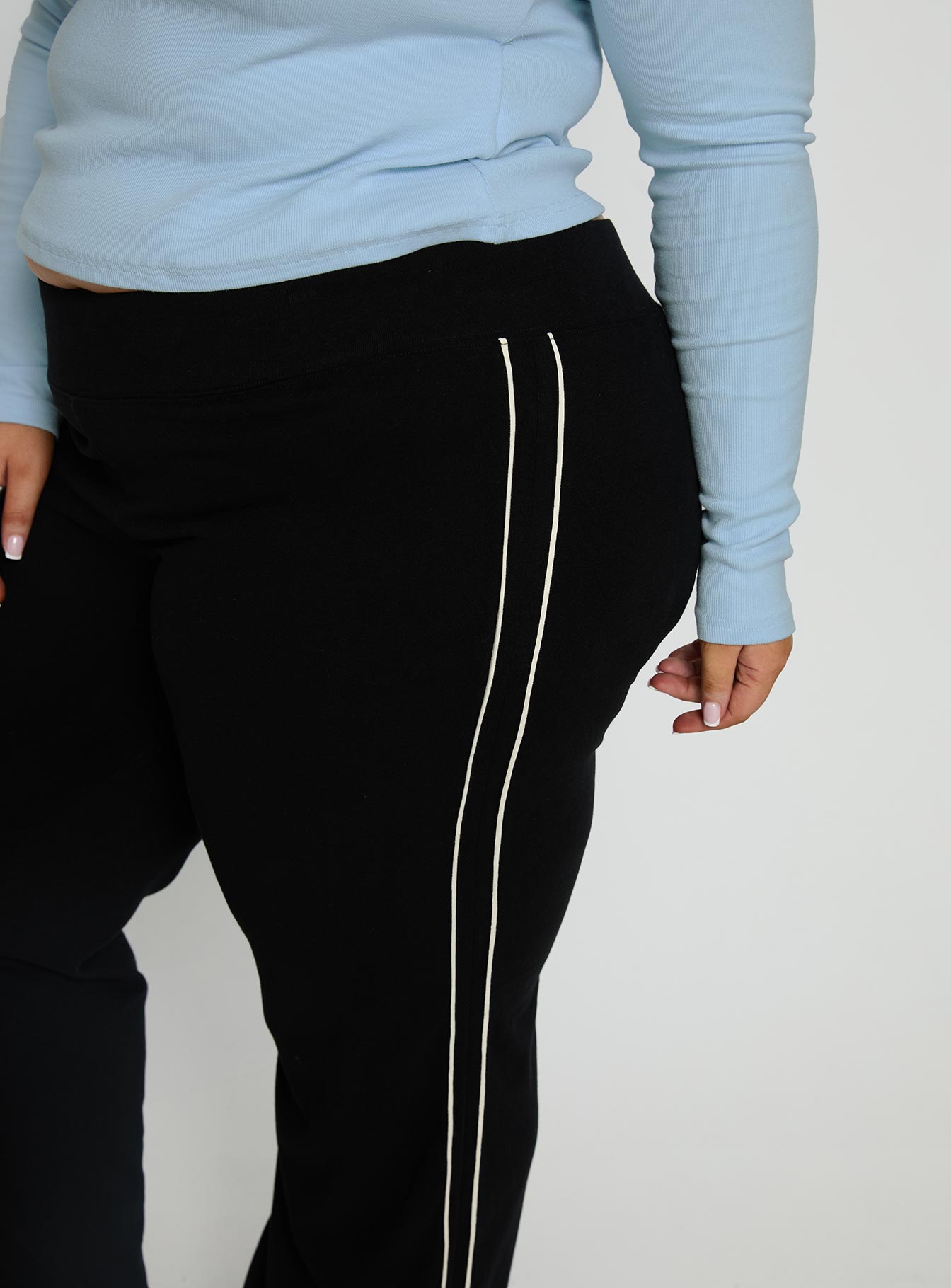 back view of model wearing Princess Polly Ascenda Straight Leg Track Pant Black Curve Mid Rise Pants 