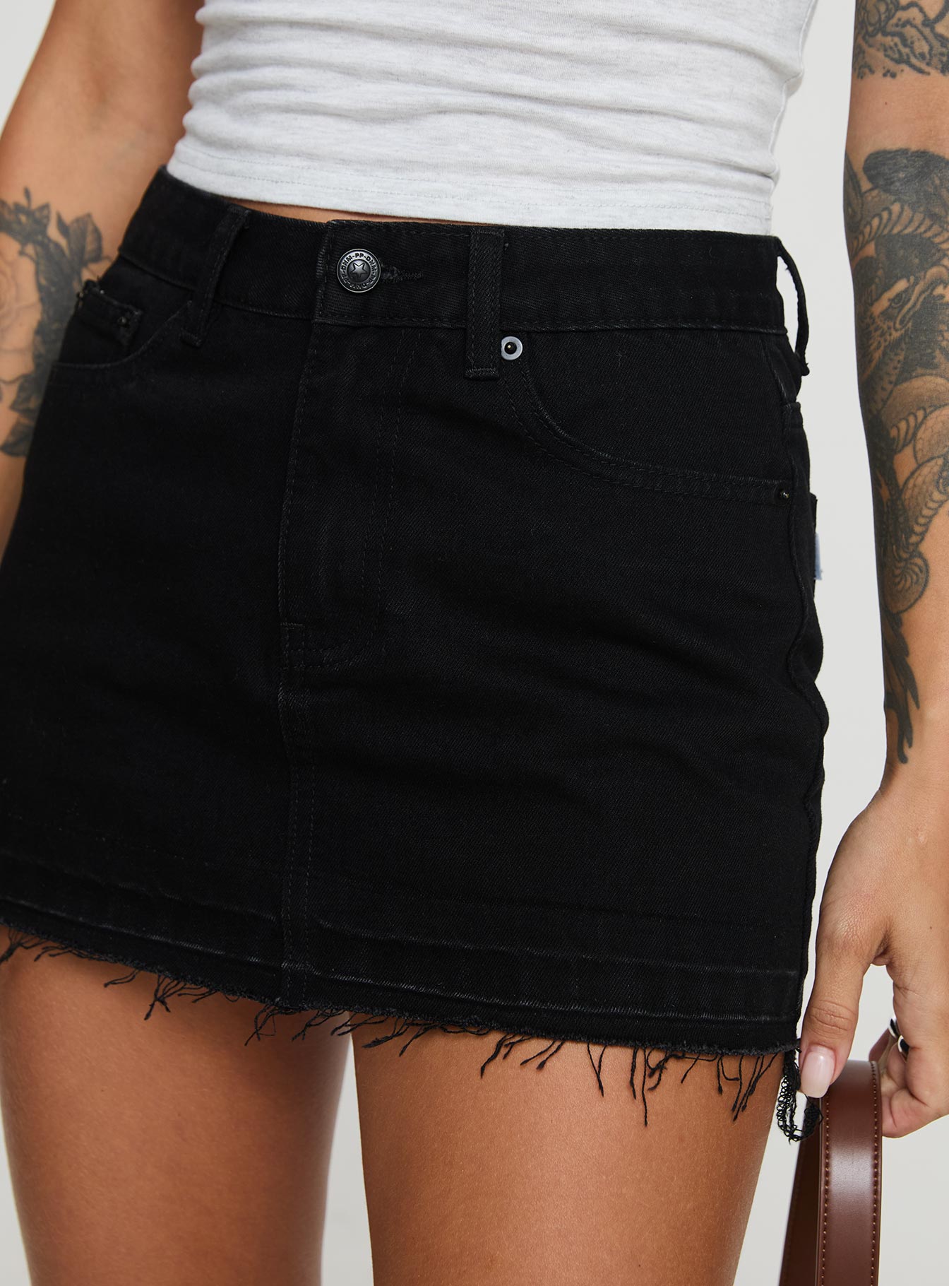 back view of model wearing Princess Polly Aster Mini Skirt Black Mini Skirts 
