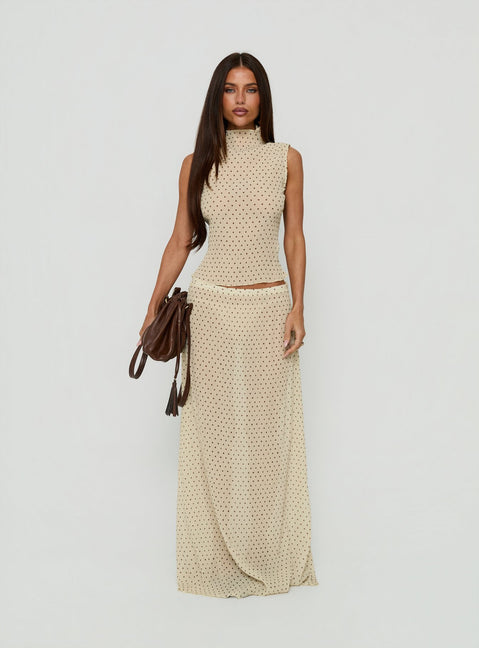 Introducing the Ford Maxi Skirt Butter Chocolate Polka Dot in womens-skirts, featuring a maxi length silhouette front view of model wearing Princess Polly