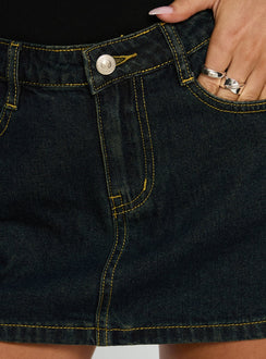   side view of model wearing Princess Polly Electric Star Patch Pocket Mini Skirt Dark Blue Wash Mini Skirts 
