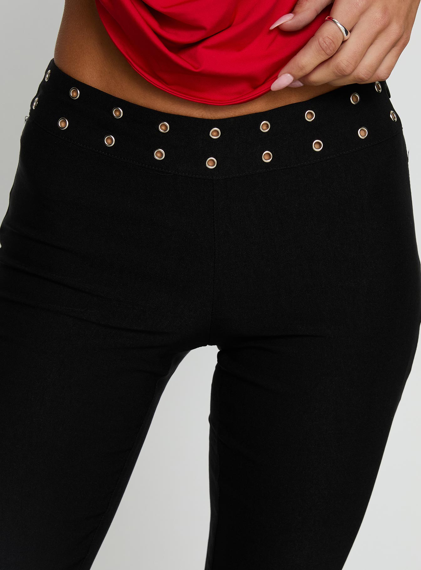 back view of model wearing Princess Polly Yevina Eyelet Flare Pant Black Low Rise Pants 