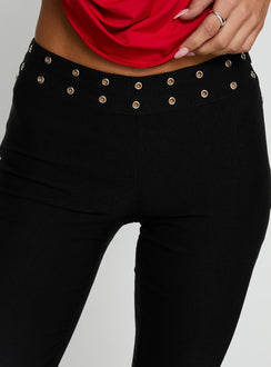 back view of model wearing Princess Polly Yevina Eyelet Flare Pant Black Low Rise Pants 
