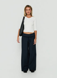 Highlighting the Amaiza Frill Drawstring Straight Leg Pants Navy in womens-regular-pants with high-rise on-body view of model wearing Princess Polly