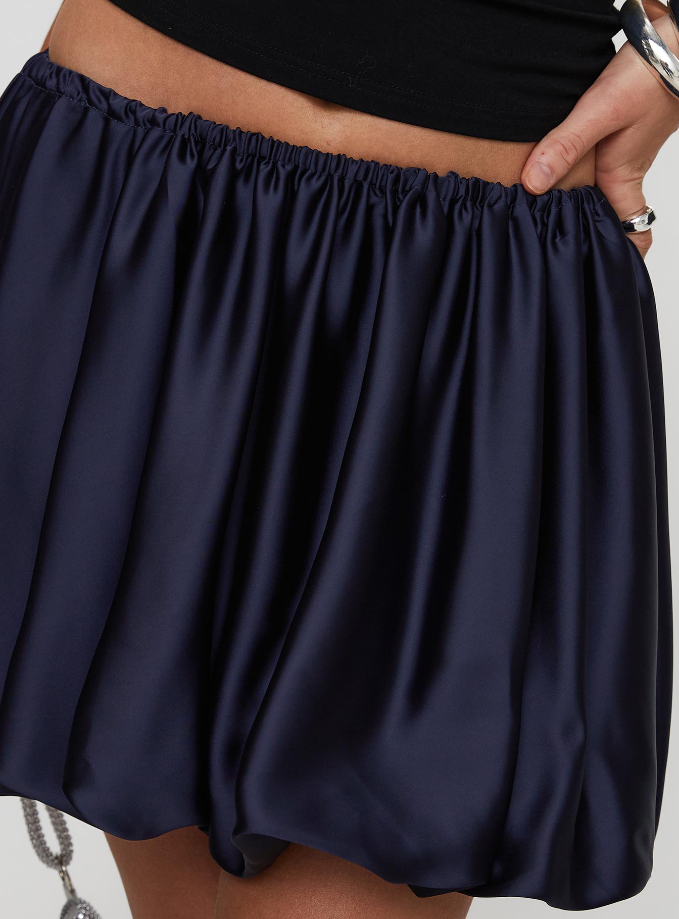 back view of model wearing Princess Polly Rubee Bubble Hem Mini Skirt Navy Mini Skirts 