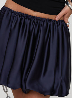 back view of model wearing Princess Polly Rubee Bubble Hem Mini Skirt Navy Mini Skirts 