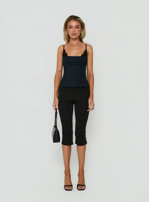 Presenting Avedon Foldover Waist Capri Pants in Black womens regular pants with high-rise on-body view of model wearing Princess Polly