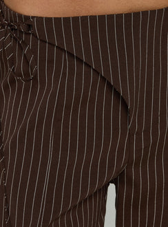 Designed with precision, the Editta Tie Detail Low Rise Tailored Pants Brown Pinstripe in womens-regular-pants with low-rise detail view of model wearing