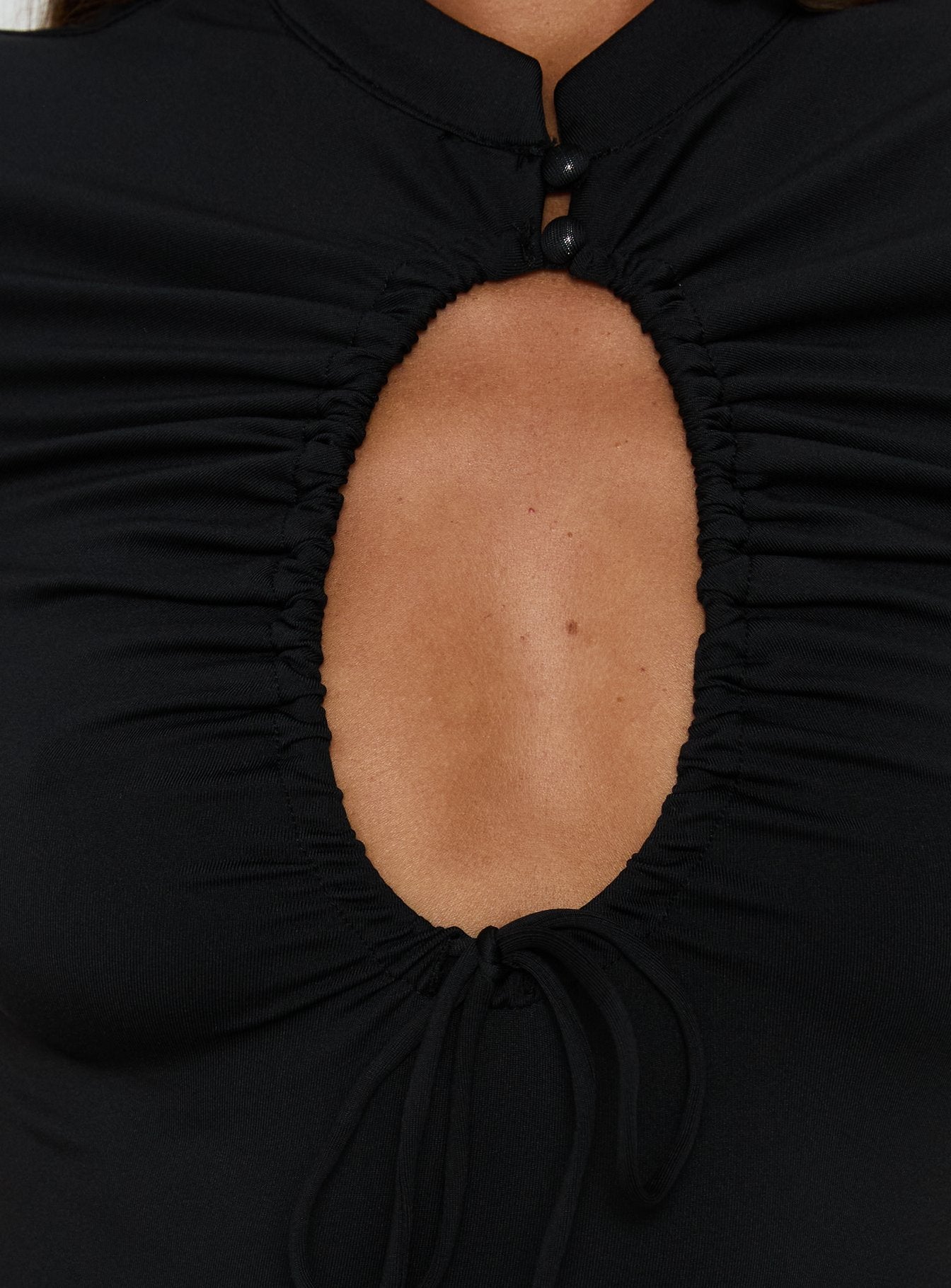 Highlighting the Maeci Ruched Tie Detail Bodysuit Black womens-bodysuit with ruched keyhole neckline and short sleeves Princess Polly