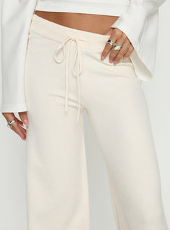 back view of model wearing Princess Polly Felisha Low Waist Knit Pants White Mid Rise Pants 