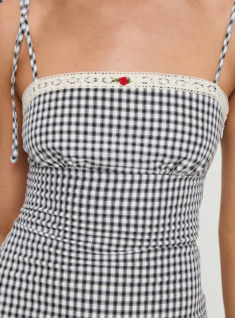 back view of model wearing Princess Polly Burkes Mini Dress Black Check Square Neck 