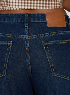 back view of model wearing Princess Polly Darla Low Rise Straight Leg Cuff Jean Dark Blue Wash Low Rise Jeans 