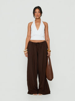 Showcasing the Bungala Oversized Relaxed Pants Brown Pinstripe womens-regular-pants with mid-rise front view of model wearing Princess Polly