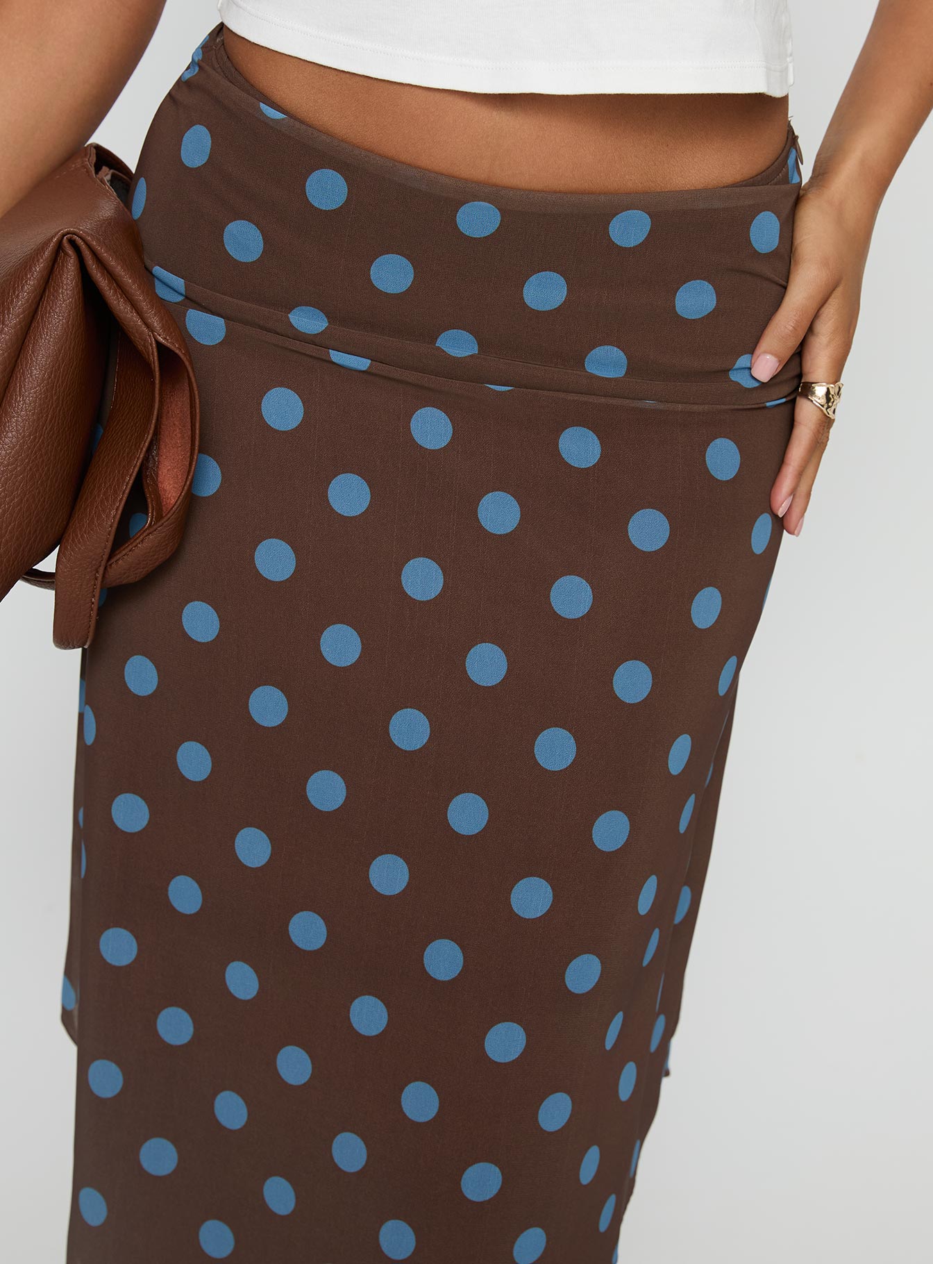 back view of model wearing Princess Polly Daphene Asymmetrical Midi Skirt Brown / Blue Polka Dot Midi Skirts 