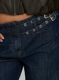 back view of model wearing Princess Polly Paltrow Mid Rise Wide Leg Cargo Jeans Dark Blue Wash Mid Rise Jeans 
