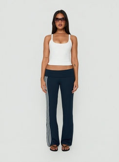 Showcasing the Layover Straight Leg Pants Navy Stripe in womens-regular-pants with mid-rise waist front view of model wearing Princess Polly