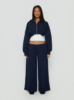 Showcasing the Kaeya Fleece Wide Leg Low Rise Pants Navy in womens regular pants with low-rise front view of model wearing Princess Polly