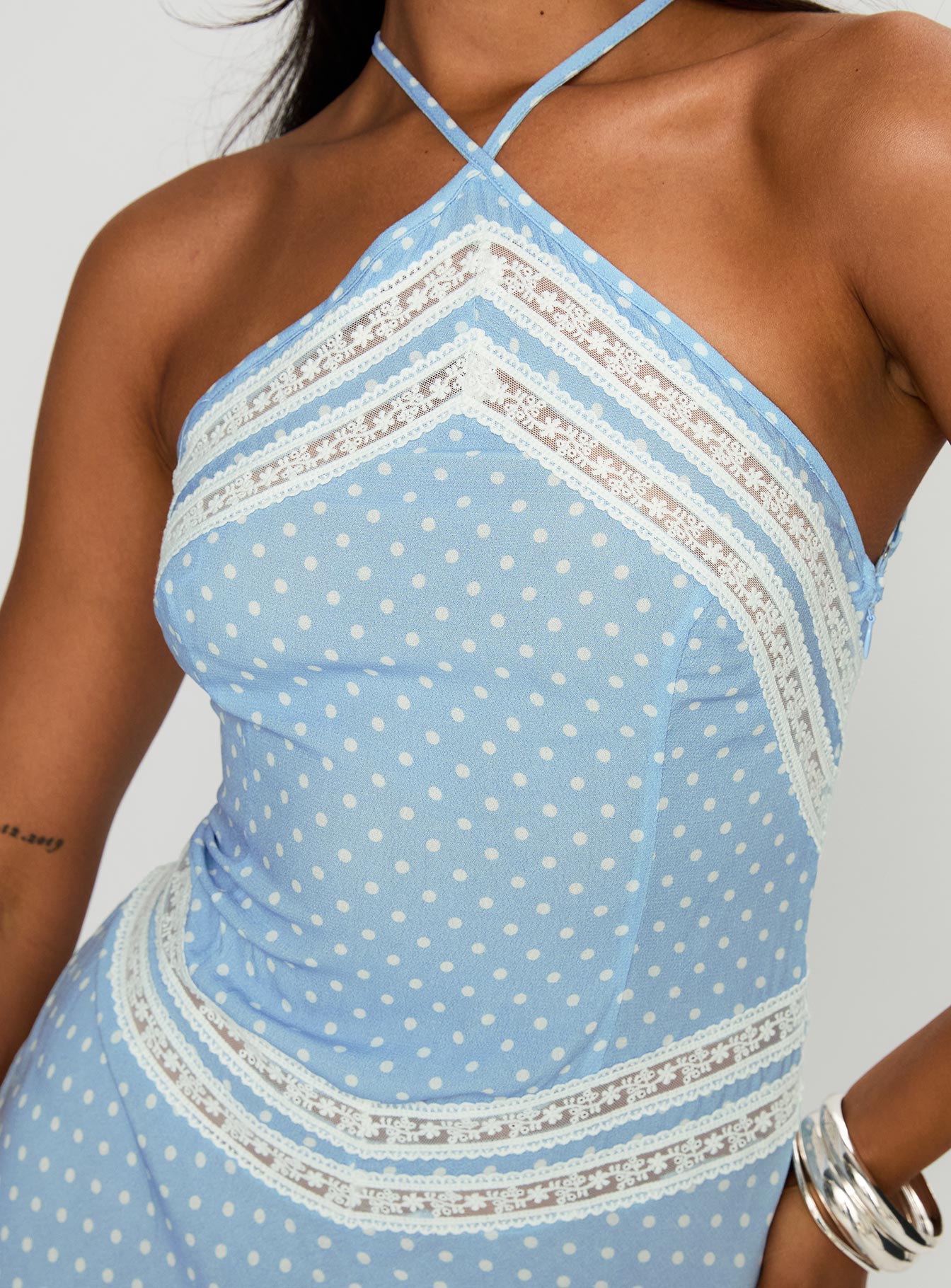 back view of model wearing Princess Polly Wild Joy Halter Maxi Dress Blue Polka Asymmetric Neckline 