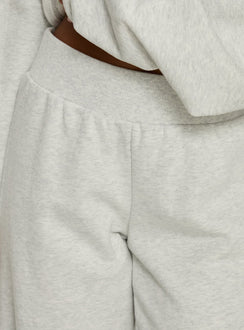 back view of model wearing Princess Polly Peaks Flared Track Pants Snow Marle Mid Rise Pants Pants 