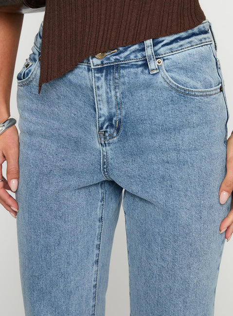 side view of model wearing Princess Polly Magic Mirror Mid Rise Bootleg Jeans Ice Wash Petite Mid Rise Jeans 