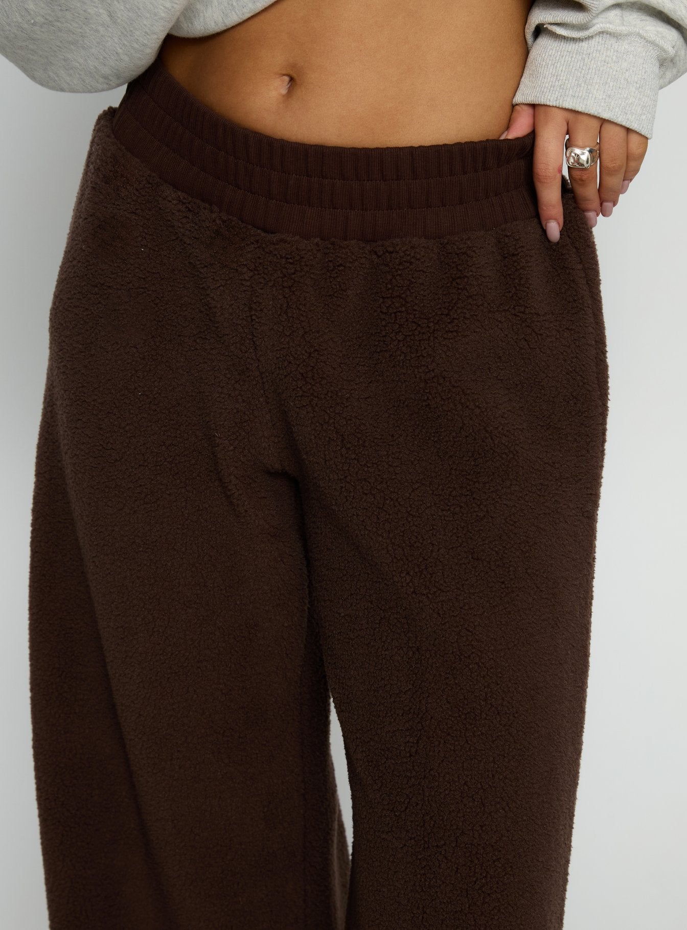 back view of model wearing Princess Polly Siberia Fleece Track Pant Chocolate Brown High Rise Pants 