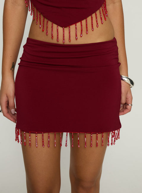 back view of model wearing Princess Polly Ginah Bead Tassel Mini Skirt Red Mini Skirts 