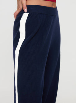 side view of model wearing Princess Polly Albright Pants Navy / Milk Mid Rise 