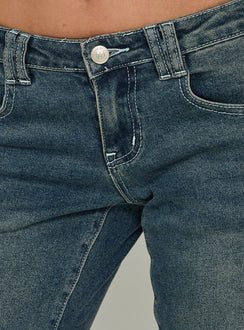 Highlighting Clynee Ultra Low Rise Bootleg Jeans Dirty Blue in womens-jeans with low-rise waist Princess Polly