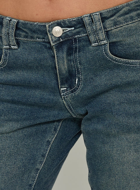 Highlighting Clynee Ultra Low Rise Bootleg Jeans Dirty Blue in womens-jeans with low-rise waist Princess Polly